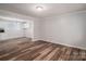 Bright, empty living room showcasing modern hardwood floors and neutral walls at 108 Graham St, Stanley, NC 28164