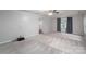 Spacious living room features neutral carpet, ceiling fan, and lots of natural light at 108 Graham St, Stanley, NC 28164