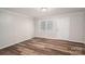 Bright, empty living room showcasing modern hardwood floors and neutral walls, with natural light at 108 Graham St, Stanley, NC 28164