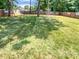 Overhead view of a backyard with lush green grass and a privacy fence at 10934 Coachman Cir, Charlotte, NC 28277