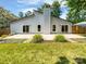 Backyard of a home with large patio and grassy yard at 10934 Coachman Cir, Charlotte, NC 28277