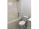 Clean, bright bathroom with tile flooring and tub/shower combo at 1103 Adams St, Statesville, NC 28677