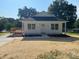 Charming single-story home with a well-maintained lawn and a welcoming front porch at 1103 Adams St, Statesville, NC 28677