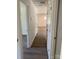 Hallway with wood-look flooring and white doors at 1103 Adams St, Statesville, NC 28677
