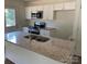 Modern kitchen with granite countertops, stainless steel appliances, and bright white cabinets at 1103 Adams St, Statesville, NC 28677