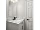 Modern bathroom vanity featuring marble countertop, dark fixtures, and updated mirror at 1133 Lynn Ln, Catawba, NC 28609