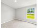 Bright bedroom with soft carpet, a large window offering an outside view at 1133 Lynn Ln, Catawba, NC 28609