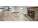 Inviting living room features a cozy stone fireplace and attractive hardwood flooring at 1133 Lynn Ln, Catawba, NC 28609