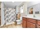 Well-lit bathroom with a shower, vanity, and wood-look floors at 1288 Century Dr, Clover, SC 29710
