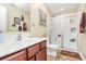 Clean bathroom featuring a vanity, toilet, and glass-enclosed shower for a refreshing experience at 1288 Century Dr, Clover, SC 29710