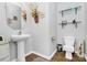 Bathroom features a pedestal sink, tile floors, and decorative shelving at 1288 Century Dr, Clover, SC 29710