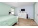 Airy bedroom with serene pastel walls, a large dresser, and plush bedding create a restful space at 1288 Century Dr, Clover, SC 29710