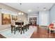 Elegant dining room with hardwood floors, stylish table, and bright natural light at 1288 Century Dr, Clover, SC 29710