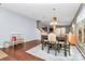 Bright dining area with hardwood floors, a large table, and cozy seating at 1288 Century Dr, Clover, SC 29710