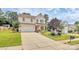 Inviting two-story home with a well-maintained lawn, spacious driveway, and a cozy front porch at 1288 Century Dr, Clover, SC 29710