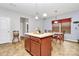 Open-concept kitchen and dining area featuring a center island and tile floors at 1288 Century Dr, Clover, SC 29710