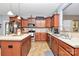 Well-lit kitchen features an island, tile flooring, and stainless steel appliances at 1288 Century Dr, Clover, SC 29710