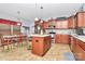 Well-equipped kitchen with stainless steel appliances, central island, and a cozy breakfast nook at 1288 Century Dr, Clover, SC 29710