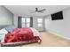 Bright main bedroom with a ceiling fan, carpet flooring, and two windows at 1288 Century Dr, Clover, SC 29710