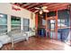 Charming covered porch with outdoor seating, a ceiling fan and access to the backyard at 1288 Century Dr, Clover, SC 29710