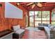 Relaxing screened-in porch with ceiling fan, comfortable seating, and a wall-mounted screen at 1288 Century Dr, Clover, SC 29710
