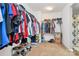 Well-organized walk-in closet with clothing racks and shelving for shoes, plus neutral carpet at 1288 Century Dr, Clover, SC 29710