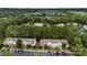 Wide shot of townhomes, landscaping, parking and surrounding trees, located in a vibrant neighborhood at 12914 Sickles Dr, Charlotte, NC 28273