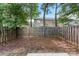 Backyard with wooden fence and treeline at 12914 Sickles Dr, Charlotte, NC 28273