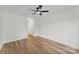 Well-lit bedroom featuring hardwood floors and a ceiling fan at 12914 Sickles Dr, Charlotte, NC 28273