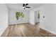 Light and airy bedroom with new floors and a large window at 12914 Sickles Dr, Charlotte, NC 28273