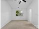 This bedroom features neutral carpet and a window at 12914 Sickles Dr, Charlotte, NC 28273