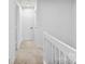 Upstairs hallway view with carpeted floor and natural light at 12914 Sickles Dr, Charlotte, NC 28273