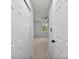 Hallway to a bedroom featuring carpet floors and bright lighting at 12914 Sickles Dr, Charlotte, NC 28273