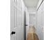 Hallway leading to the bathroom with ample closet space at 12914 Sickles Dr, Charlotte, NC 28273