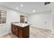 Kitchen island featuring granite counters and ample storage at 12914 Sickles Dr, Charlotte, NC 28273