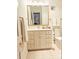 Bright bathroom featuring a vanity with ample storage and gold hardware, complementing the space's clean design at 1323 Queens Rd # 327, Charlotte, NC 28207