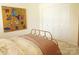 Comfortable bedroom with plush carpet, a metal bed frame, and ample closet space at 1323 Queens Rd # 327, Charlotte, NC 28207
