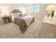 Inviting bedroom featuring a unique rattan headboard, soft lighting and neutral tones at 1323 Queens Rd # 327, Charlotte, NC 28207