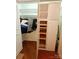 Organized closet with wooden shelving and hanging space, maximizing storage in the bedroom at 1323 Queens Rd # 327, Charlotte, NC 28207