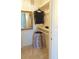 Reach-in closet with rod and shelf, plus a mirror on the wall at 1323 Queens Rd # 327, Charlotte, NC 28207