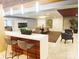 Community clubhouse with bar, lounge seating, fireplace, and dining table at 1323 Queens Rd # 327, Charlotte, NC 28207