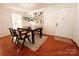 Welcoming dining room featuring a modern dining set, art, and access to the kitchen at 1323 Queens Rd # 327, Charlotte, NC 28207