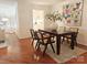 Cozy dining area featuring a modern table, chairs, and colorful butterfly artwork at 1323 Queens Rd # 327, Charlotte, NC 28207