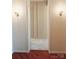 Neutral hallway with sconce lights and door to bathroom offers a clean design at 1323 Queens Rd # 327, Charlotte, NC 28207