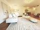 Spacious living area with a large sofa, patterned rug, and hardwood floors at 1323 Queens Rd # 327, Charlotte, NC 28207