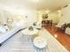 Spacious living room with a curved sofa, area rug, and an open floor plan at 1323 Queens Rd # 327, Charlotte, NC 28207