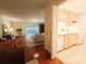 Inviting living room with hardwood floors, opening to a cozy kitchen with white appliances and ample counter space at 1323 Queens Rd # 327, Charlotte, NC 28207
