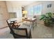Well-lit office featuring built-in cabinets, a modern desk, and a large potted plant at 1323 Queens Rd # 327, Charlotte, NC 28207