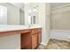 This bathroom features a white vanity, a sink, a mirror, and a tiled shower and tub at 1427 Rosemont Dr, Indian Land, SC 29707