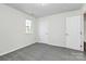 This bedroom features neutral walls, carpet flooring, two bright windows, and a closet at 1427 Rosemont Dr, Indian Land, SC 29707